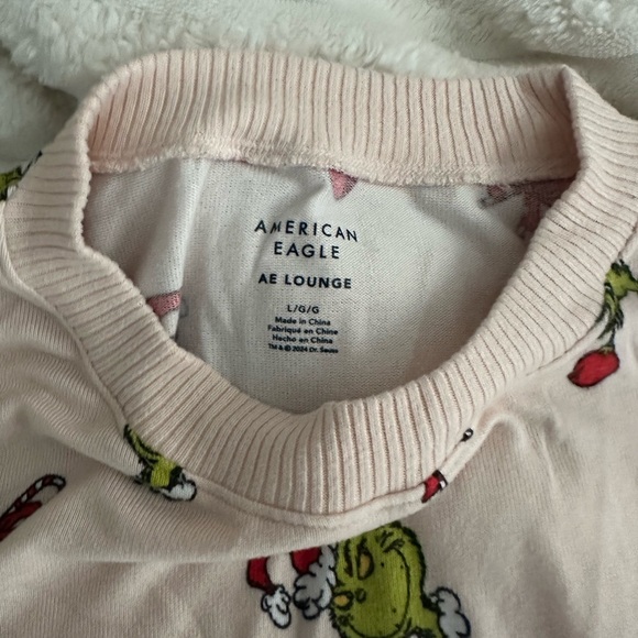 American Eagle Outfitters Light Pink Grinch Lounge Top - Picture 2 of 2
